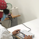 One of the study’s researchers demonstrating the set-up used to confirm the success of the gene therapy treatment, including the use of specialized goggles seen above.